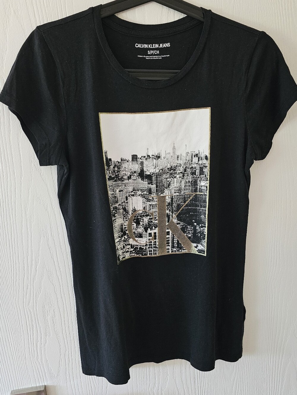 Calvin Klein Jeans Black Tee with Gold-Trim City Graphic